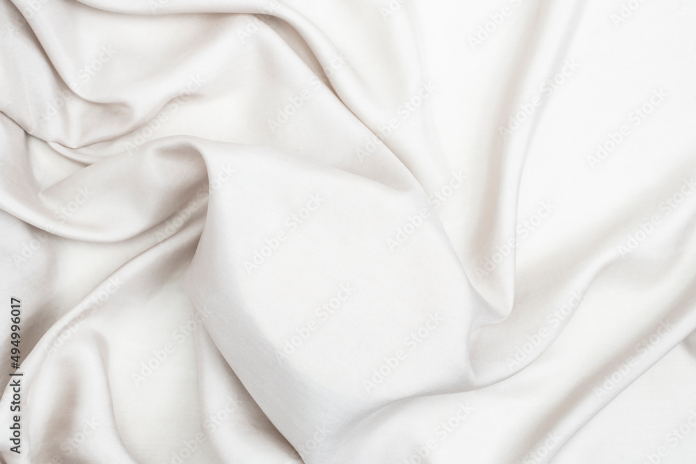 Elegant light silk or satin texture that can be used as a mockup for products. Luxurious backdrop design Elegant light silk or satin texture that can be used as a mockup for products. Luxurious backdrop design