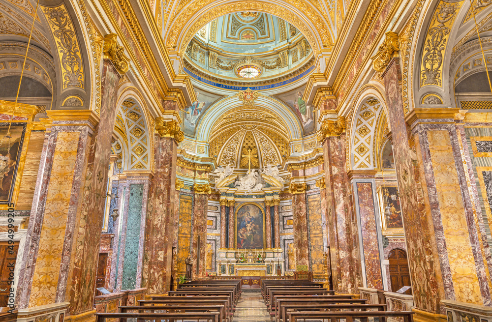 ROME, ITALY - AUGUST 30, 2021: The nave of baroque church Chiesa dei Santi Claudio e Andrea dei Borgognoni .