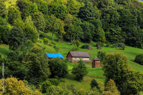 Mountains in the summer in sunny weather and houses