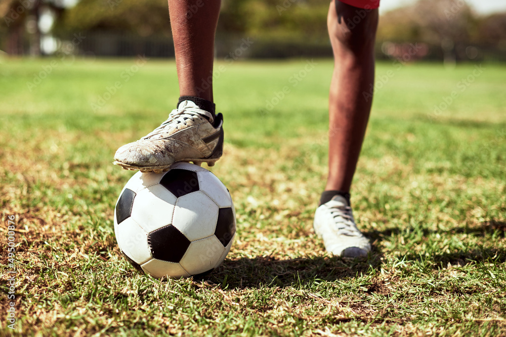 You have to be quick on your feet in this game. Closeup shot of a young boy playing soccer on a sports field. You have to be quick on your feet in this game. Closeup shot of a young boy playing soccer on a sports field.