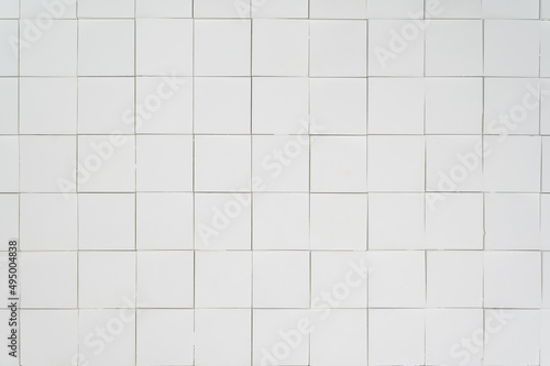 a white textured wall made of three-dimensional square segments.