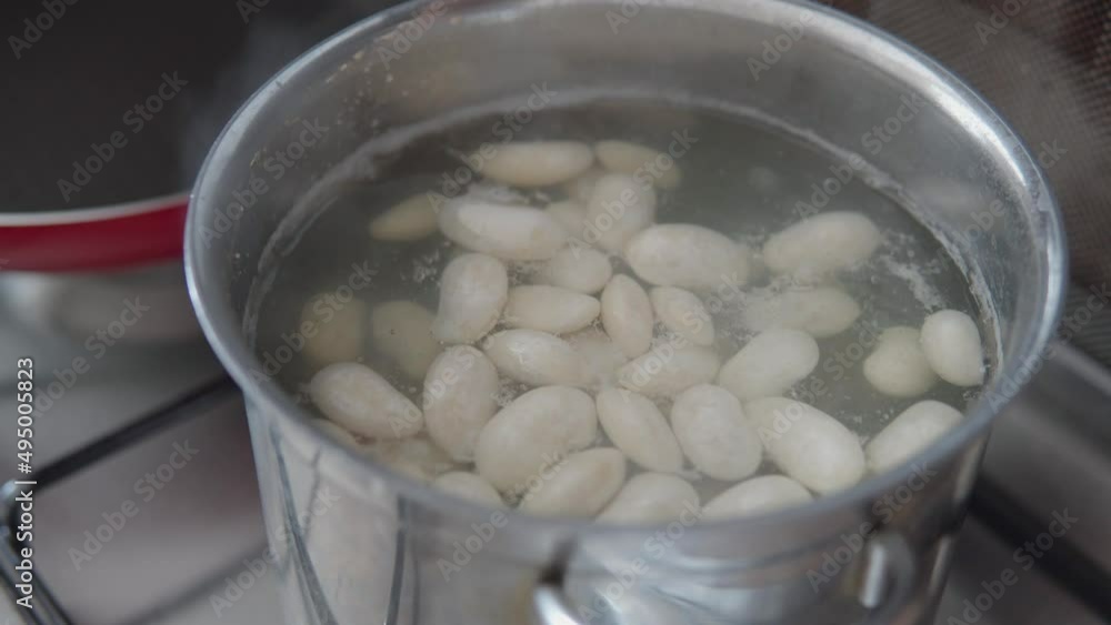 White beans the most important ingredient of Ukrainian borsch cooked in a boiling water. White beans the most important ingredient of Ukrainian borsch cooked in a boiling water.