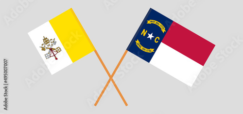Crossed flags of Vatican and The State of North Carolina. Official colors. Correct proportion