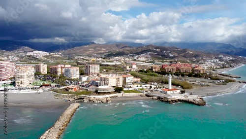 Torrox Costa view from above. Drone footage of this costal city situated in Malaga province, Costa del Sol - Spain. Touristic travel destination. Drone rotating and panning right photo