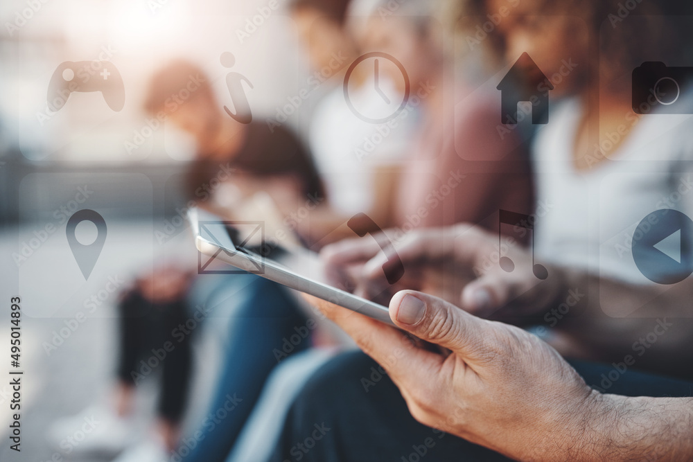 Spreading the word out. Shot of a group of unrecognizable businesspeople using their digital devices while sitting on a bench together outdoors.