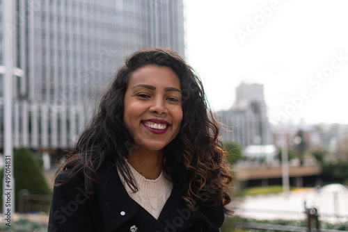 Young beautiful woman portrait, African student girl in a city, Young businesswoman smiling outdoor, People, enjoy life, student lifestyle, city life, business concept photo