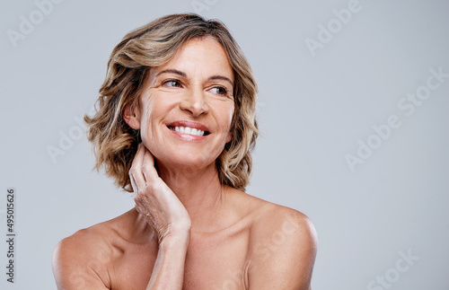 Were happier when we feel good about ourselves. Shot of a beautiful mature woman posing against a white background. photo
