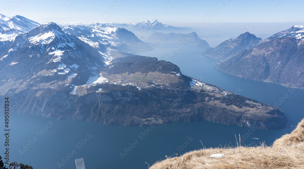 Pilatus – the dragon mountain on Lucerne’s doorstep. Escape the city and head up to Pilatus Kulm at an altitude of 2'132 m on the world’s steepest cogwheel railway. The arrival by boat or by train - obrazy, fototapety, plakaty 
