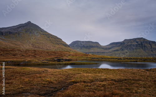 Dramatic cloudy faroese weather in Nordradalur, Streymoy island. Faroe islands, Denmark. November 2021