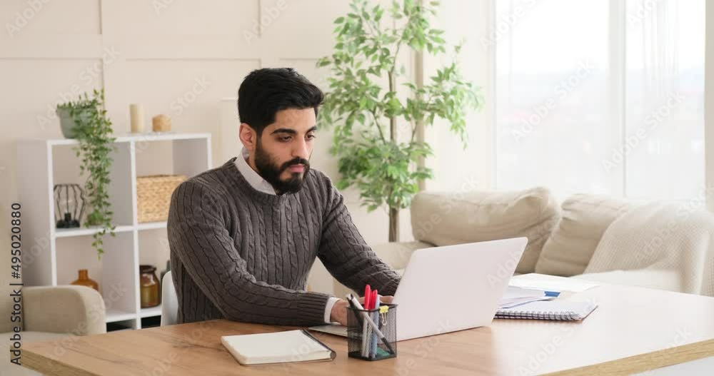 Businessman working on laptop and analyzing document at office Businessman working on laptop and analyzing document at office