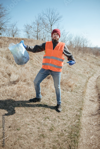 Cleaning trash in the forest, ecoactivist photo