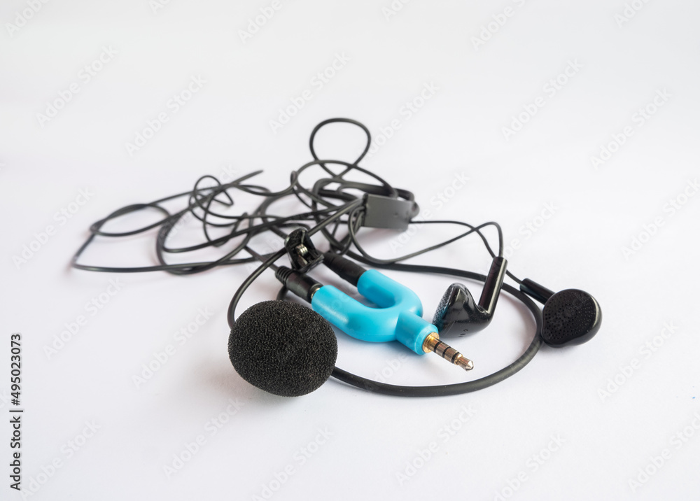 headphone and microphone using splitter jack isolated on white background headphone and microphone using splitter jack isolated on white background