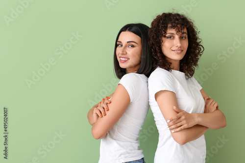 Beautiful sisters with cros...