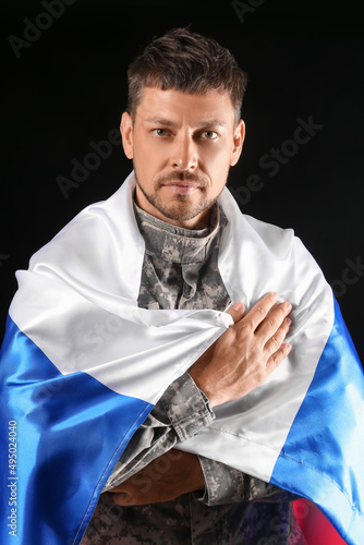 Soldier with flag of Russia...