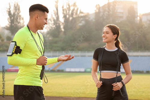 Sporty young couple with sk...