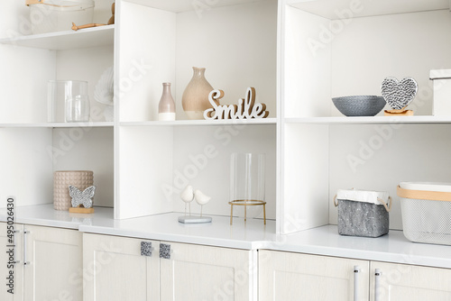 Shelf unit with beautiful decor in room © Pixel-Shot