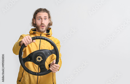 Surprised man with steering...