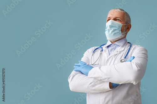 Mature male doctor in medic...