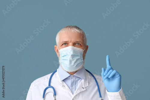 Mature male doctor in medic...
