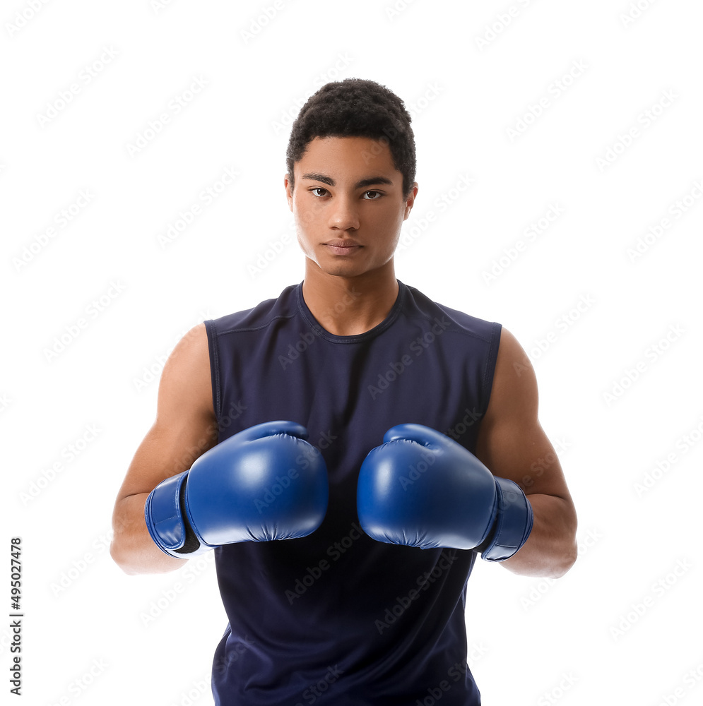 Young African-American man with boxing gloves on white background. Immunity concept Young African-American man with boxing gloves on white background. Immunity concept