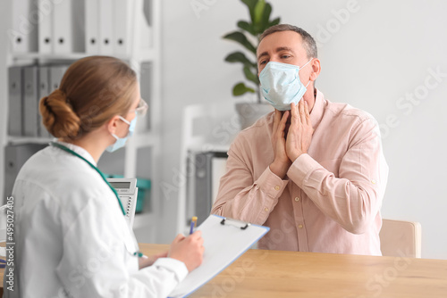 Ill man with sore throat vi...