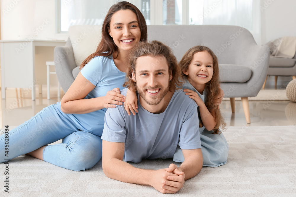 Young family on soft carpet at home Young family on soft carpet at home