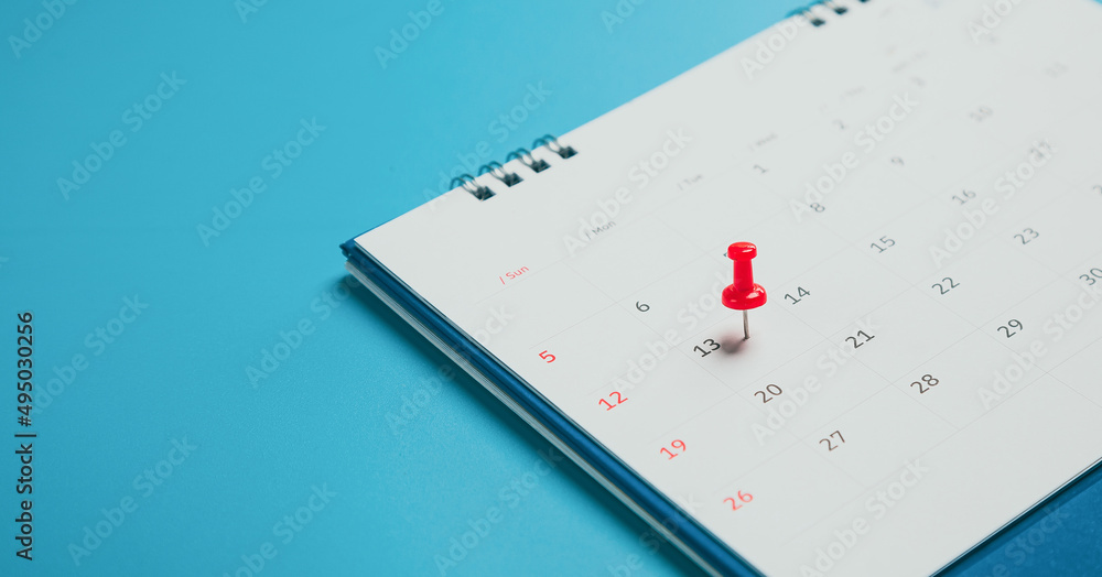 Close top view on white calendar 2022 month schedule Work planning and life concept. Close top view on white calendar 2022 month schedule Work planning and life concept.