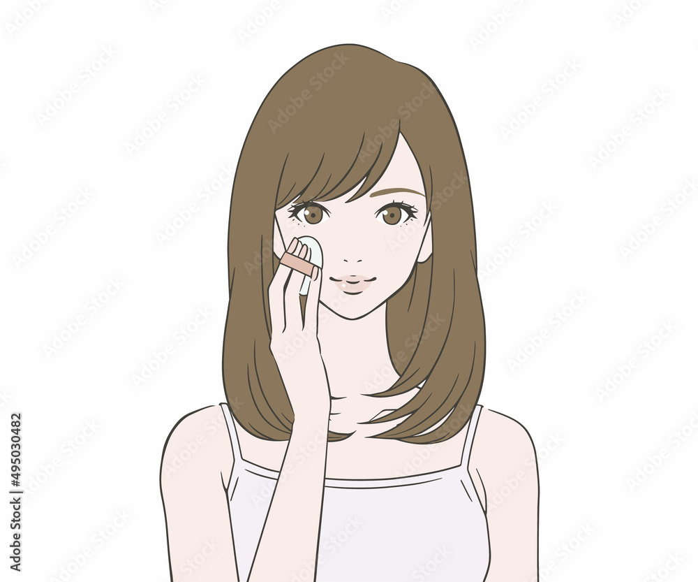 笑顔でファンデーションを塗る女性 笑顔でファンデーションを塗る女性