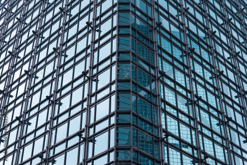 Exterior mirror glass of modern office building abstract pattern background. Detail of building and architecture concept.