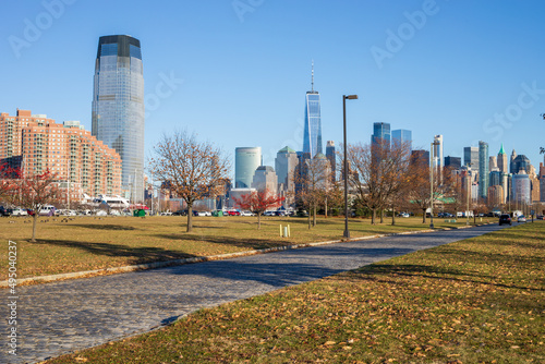 Jersey City, New Jersey, USA - December 22 2021: New York City downtown skyline. Financial district and World Trade Center. View from Statue of Liberty State Park. photo