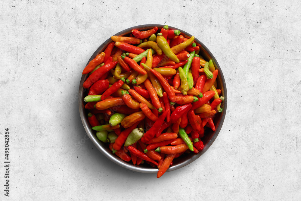 ingredients for chili sauce of chili, cayenne pepper, shallot, garlic in plate and in closeup view ingredients for chili sauce of chili, cayenne pepper, shallot, garlic in plate and in closeup view