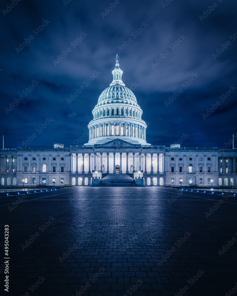 US Capitol Building at night.
