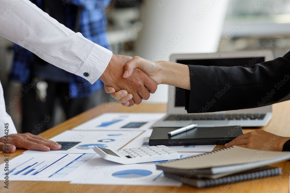 Businessman handshake for teamwork of business merger and acquisition,successful negotiate,hand shake,two businessman shake hand with partner to celebration partnership and business deal concept Businessman handshake for teamwork of business merger and acquisition,successful negotiate,hand shake,two businessman shake hand with partner to celebration partnership and business deal concept