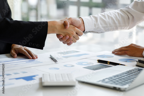 Business handshake for teamwork of business merger and acquisition,successful negotiate,hand shake,two businessman shake hand with partner to celebration partnership and business deal concept