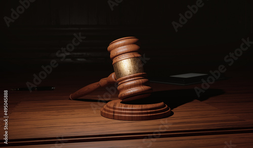 Gavel or Hammer on Wooden Table in Law Office. 3D Render with Detailed Texture. Soft Light. Pen and Papers Out of Focus in Background. Legislations, Legal Acts, Tribunal Concept.