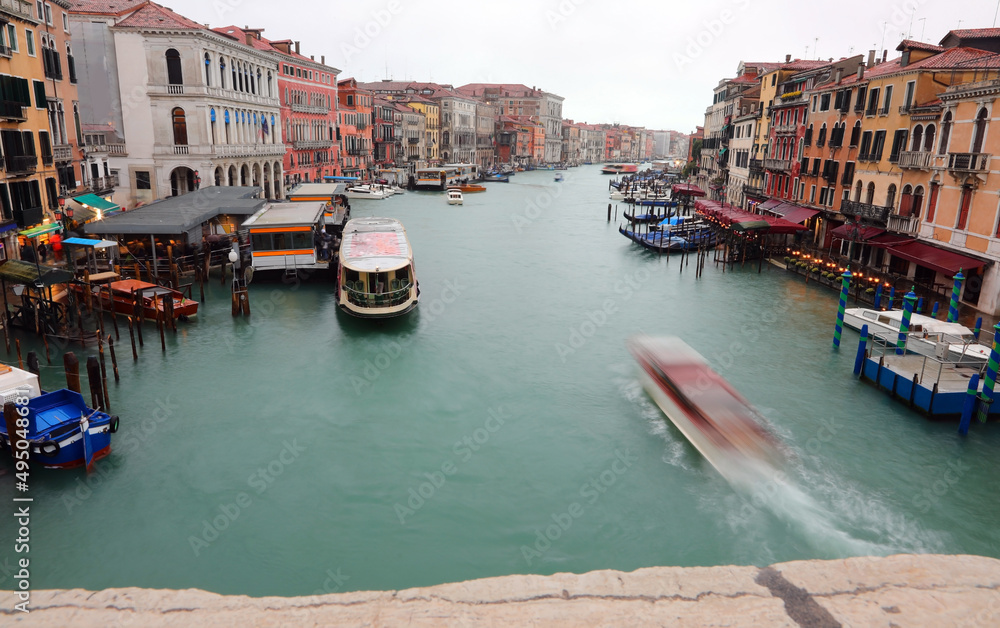 vaporettos traveling fast in the Grand Canal in Venice with the long exposure technique