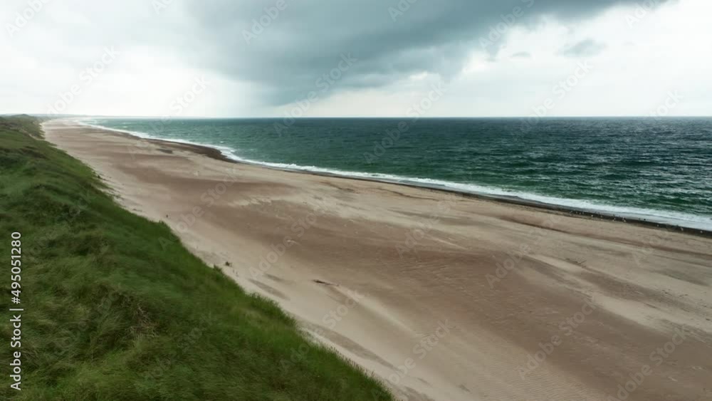 Drone Over Grass And Sandy Beach Of Jutland Coastline With Horizon Drone Over Grass And Sandy Beach Of Jutland Coastline With Horizon