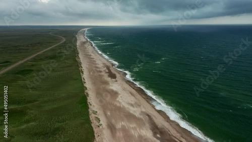 Drone Over Grass And Sandy Beach Of Jutland Coastline With Horizon photo