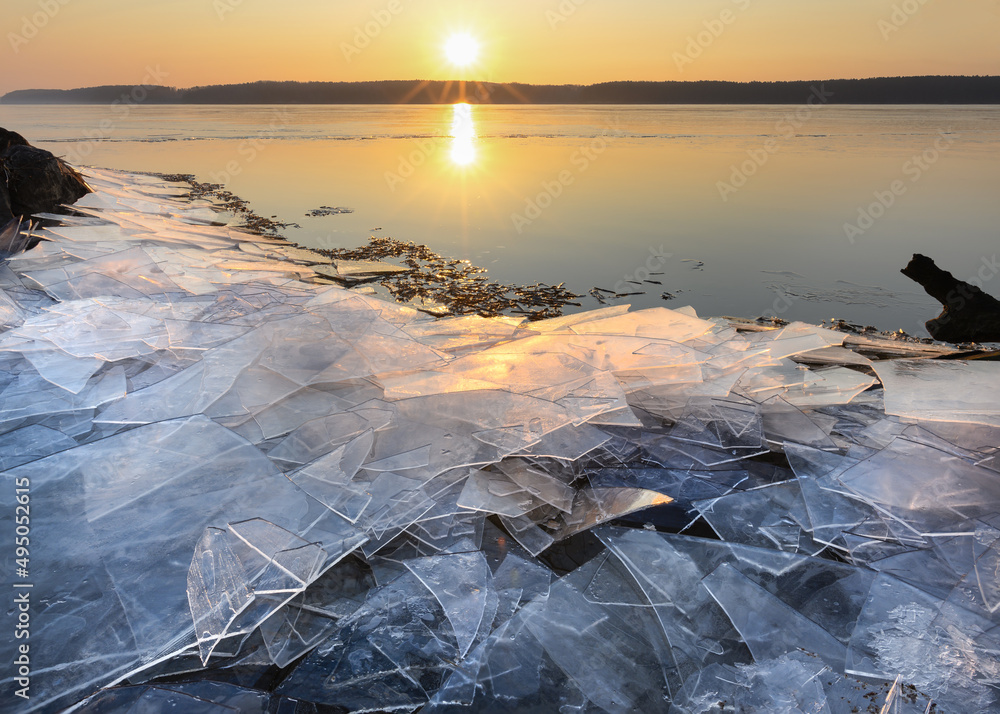 Kaunas lagoon, ice on the shores, beautiful sunny morning. Frozen ice, looks like shards of glass. Beautiful scenery, desktop photo.