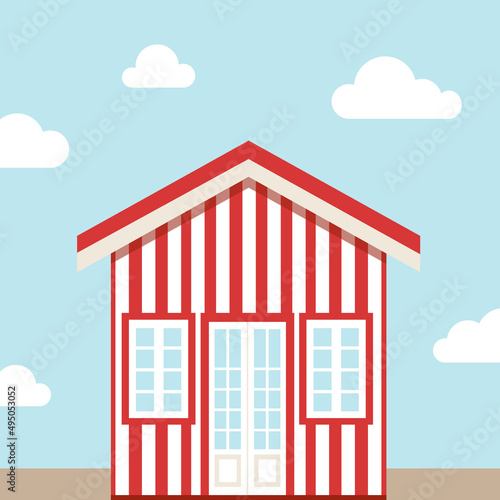 Red and white bitch house with blue sky and clouds