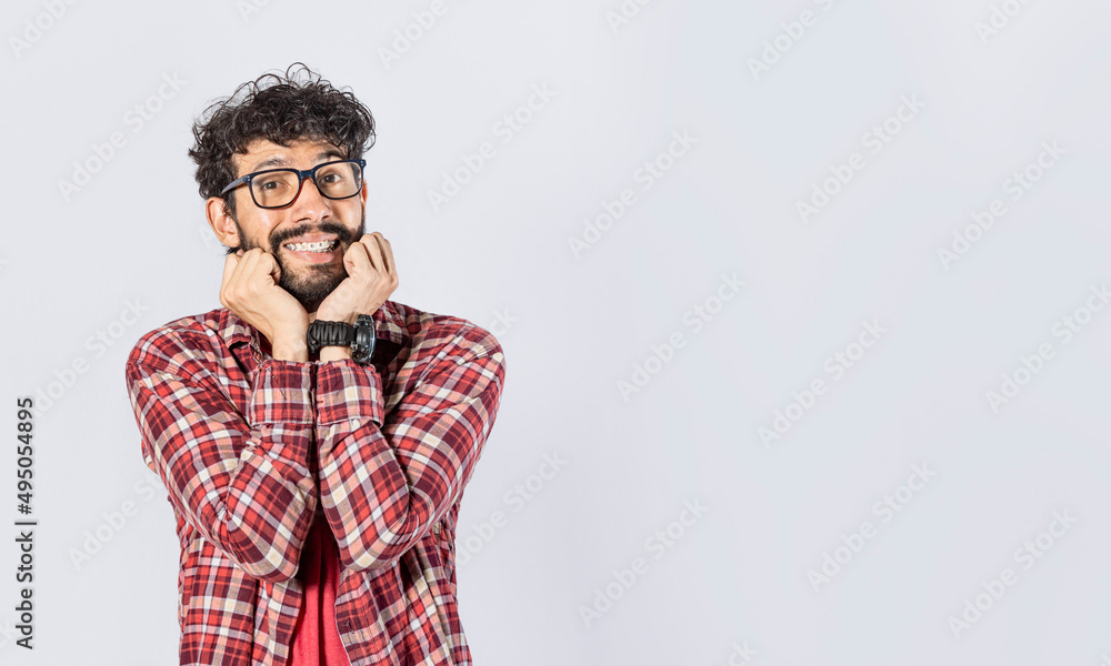 Handsome man in glasses smiling kindly, close up of smiling man touching his cheeks on isolated background, face of smiling friendly guy with hands on cheek Handsome man in glasses smiling kindly, close up of smiling man touching his cheeks on isolated background, face of smiling friendly guy with hands on cheek