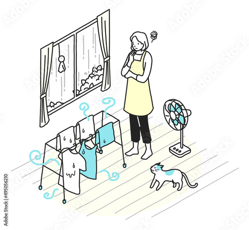 部屋干しで洗濯物のニオイに悩む女性