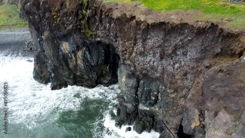 Aerial view of rock and foamy sea at Madeira, Portugal by drone