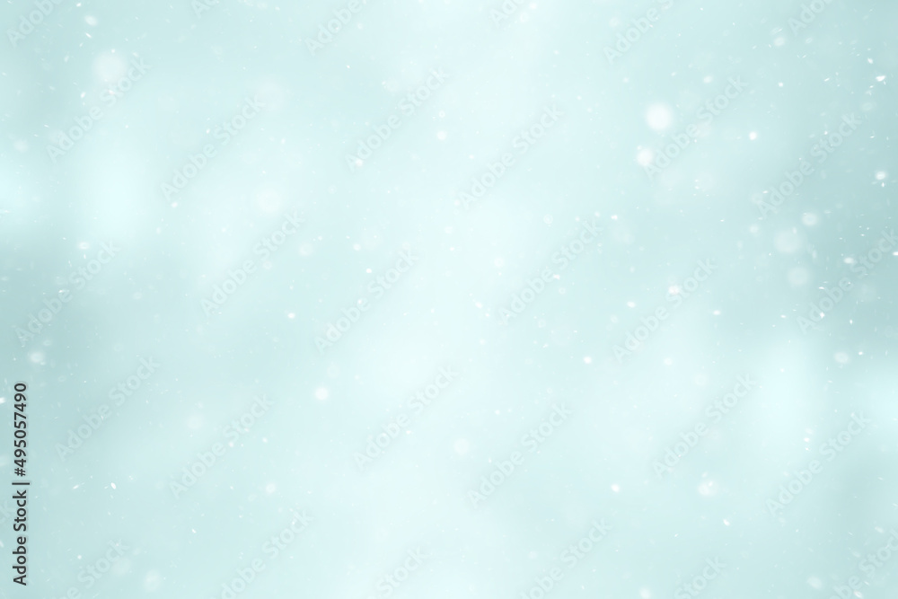 blurred snow / winter abstract background, snowflakes on abstract blurred glowing leaf background blurred snow / winter abstract background, snowflakes on abstract blurred glowing leaf background