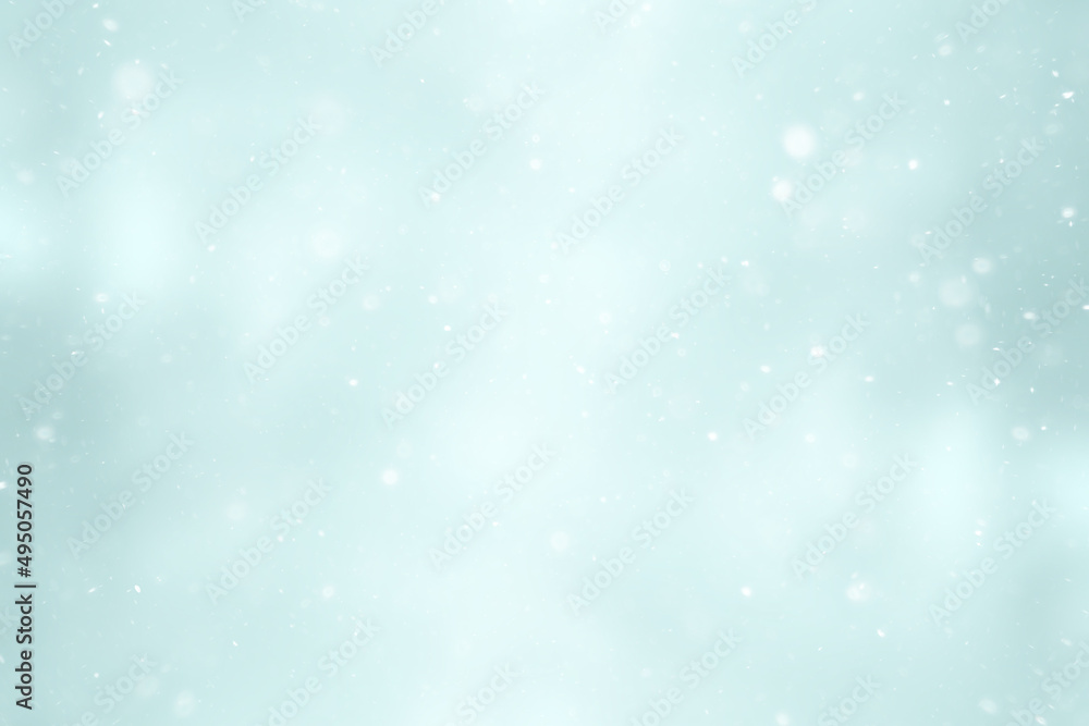 blurred snow / winter abstract background, snowflakes on abstract blurred glowing leaf background