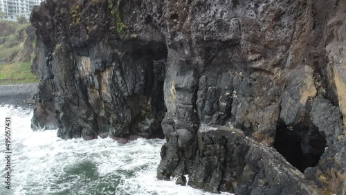 Aerial view of awsome rock and foamy sea at Madeira, Portugal by drone