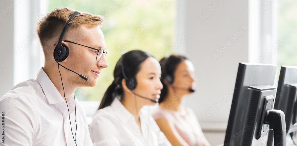 Team of professional support staff working in the office. Colleagues in the workplace solve customer problems. Call center and customer support concept. Team of professional support staff working in the office. Colleagues in the workplace solve customer problems. Call center and customer support concept.