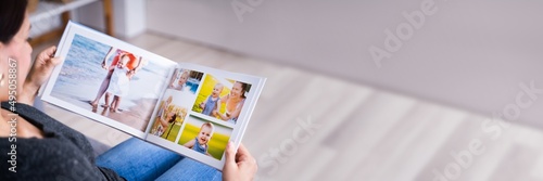 Woman Looking At Photo Album photo