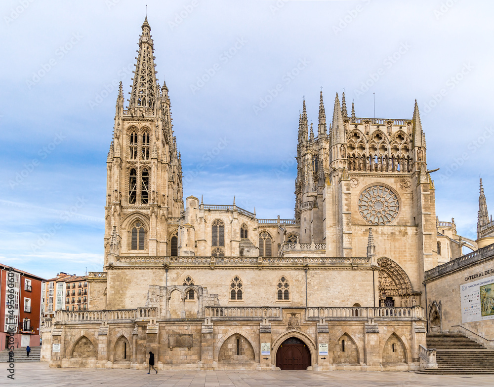 Burgos Cathedral with people and tourists walking past in the square next to the Cathedral of Saint Mary