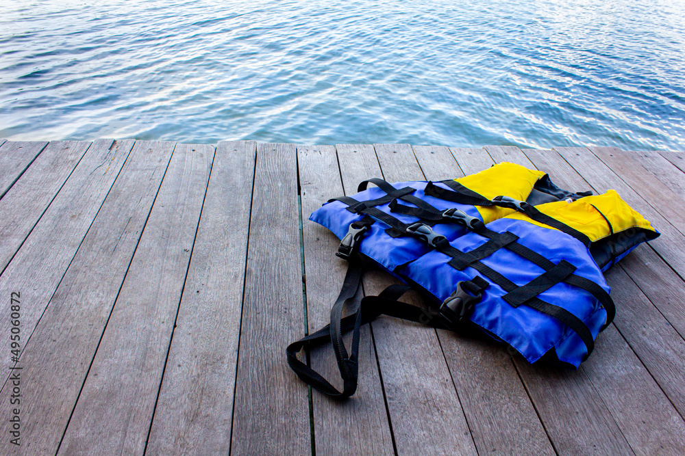 life jacket on wooden floor for product placementwith natural pattern texture.